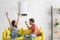 The image shows two people sitting on a couch.