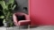 The image shows an armchair and a plant.