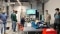 The image shows a group of employees.